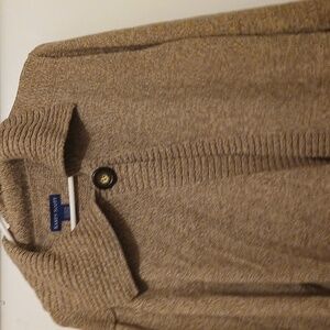 women's tan sweater with one button with a brown button to fasten. over hang